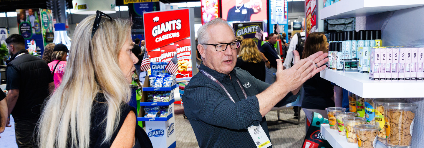 Exhibitor talking to attendee